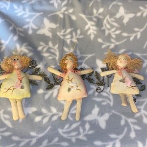 Set of cloth dolls with metal wings.